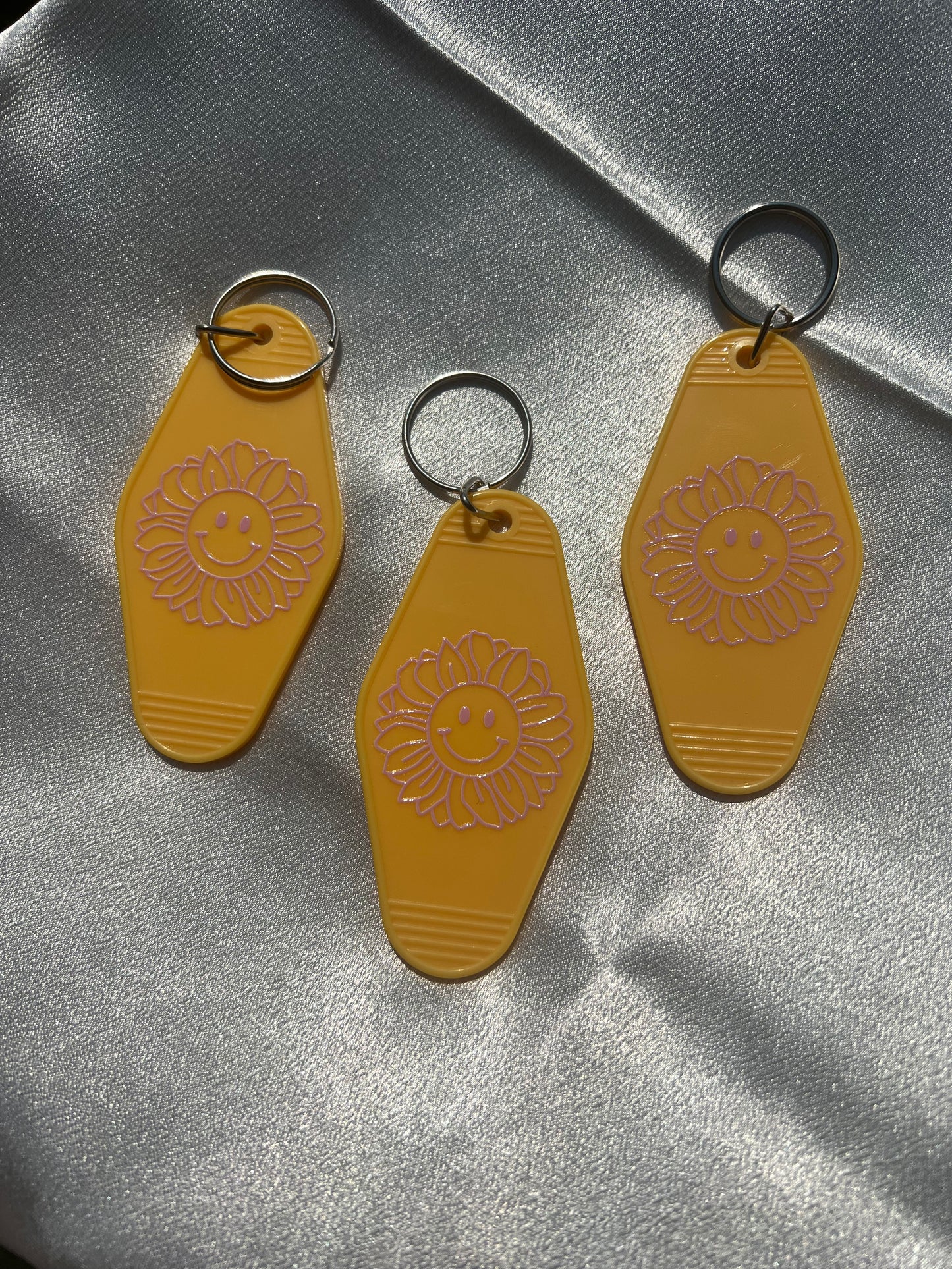 Yellow Flower Smiley Face Motel Keychain